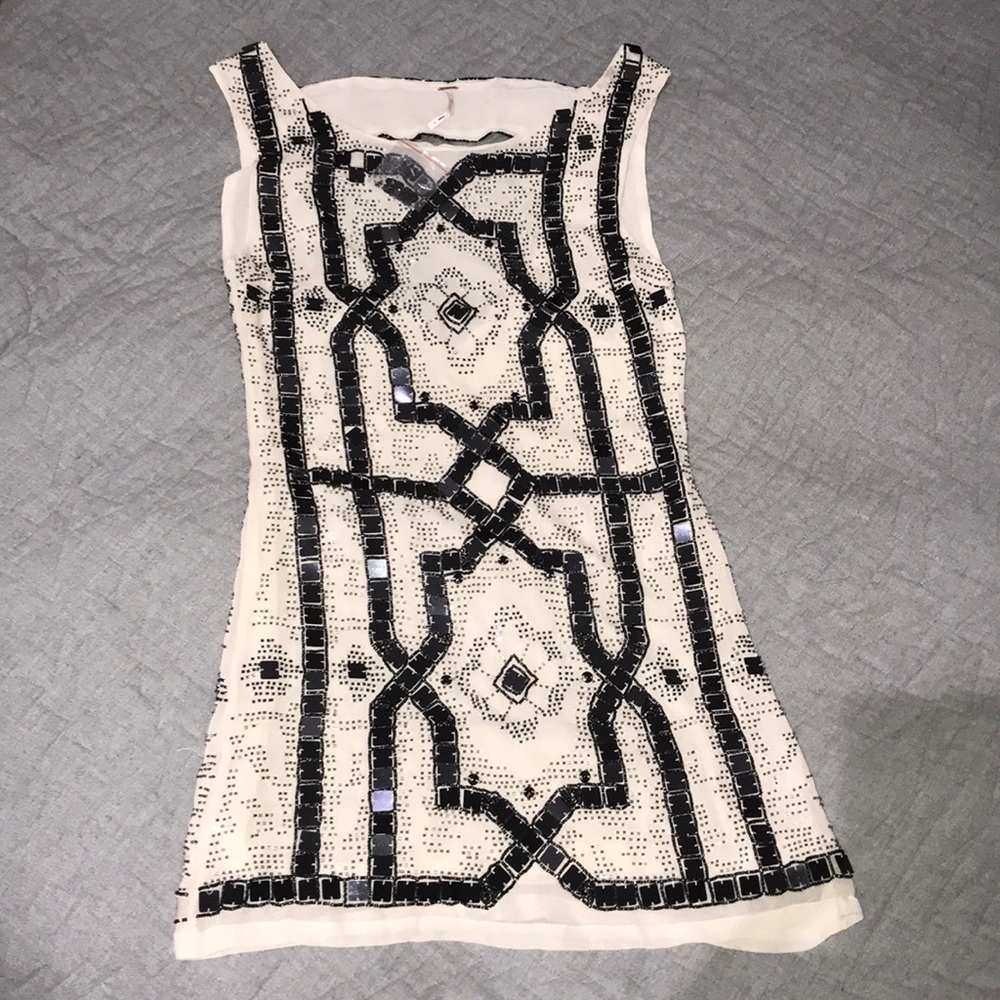 NOWT. Free People white dress with black sequins.